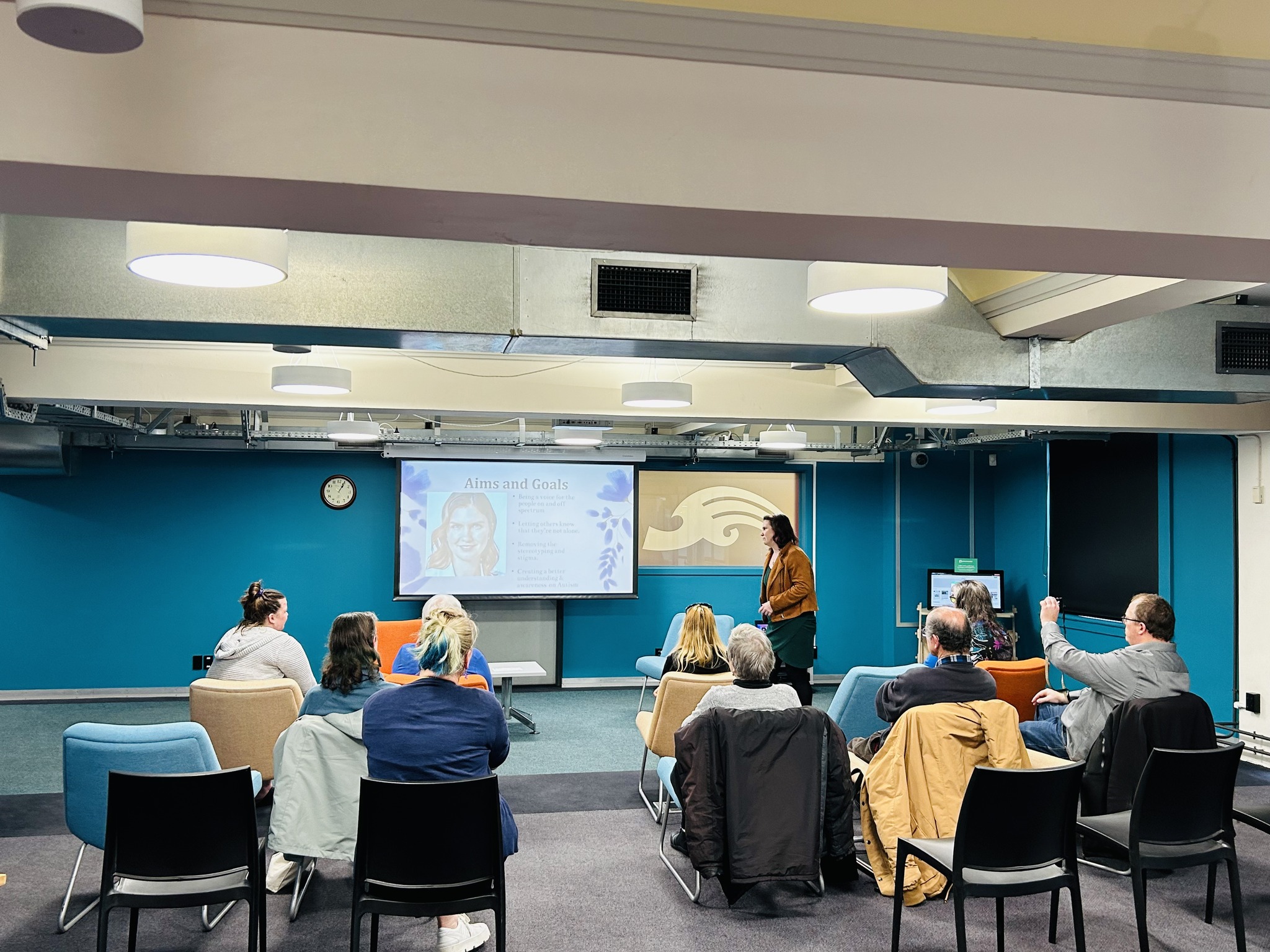 Kerrin presenting the aims and goals of Aspie Answers at a book reading