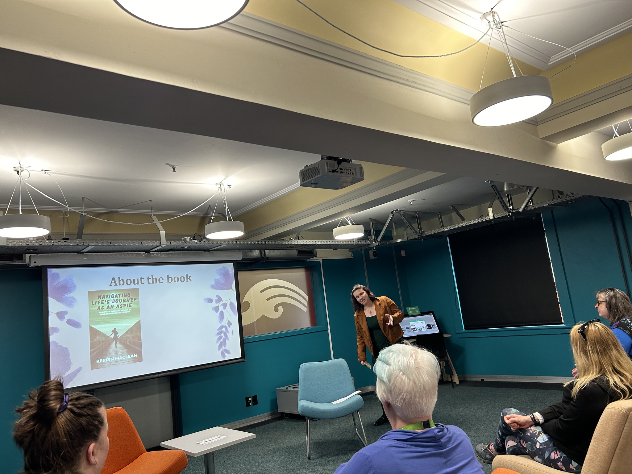 Kerrin speaking at a Palmerston North book-reading event